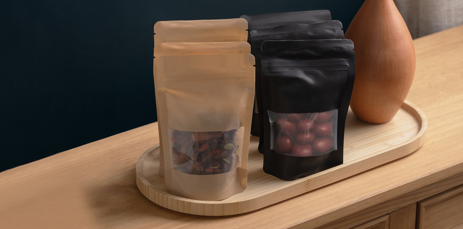 Torn Ranch recyclable tins and compostable pouches demonstrating sustainable, premium minibar packaging.