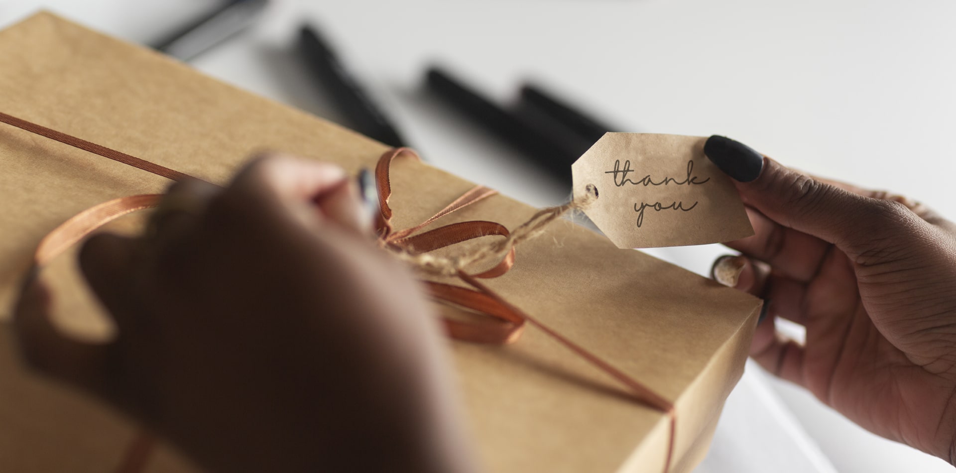 HR professional gifting an employee for recognition, showing the emotional impact of small appreciation gifts.