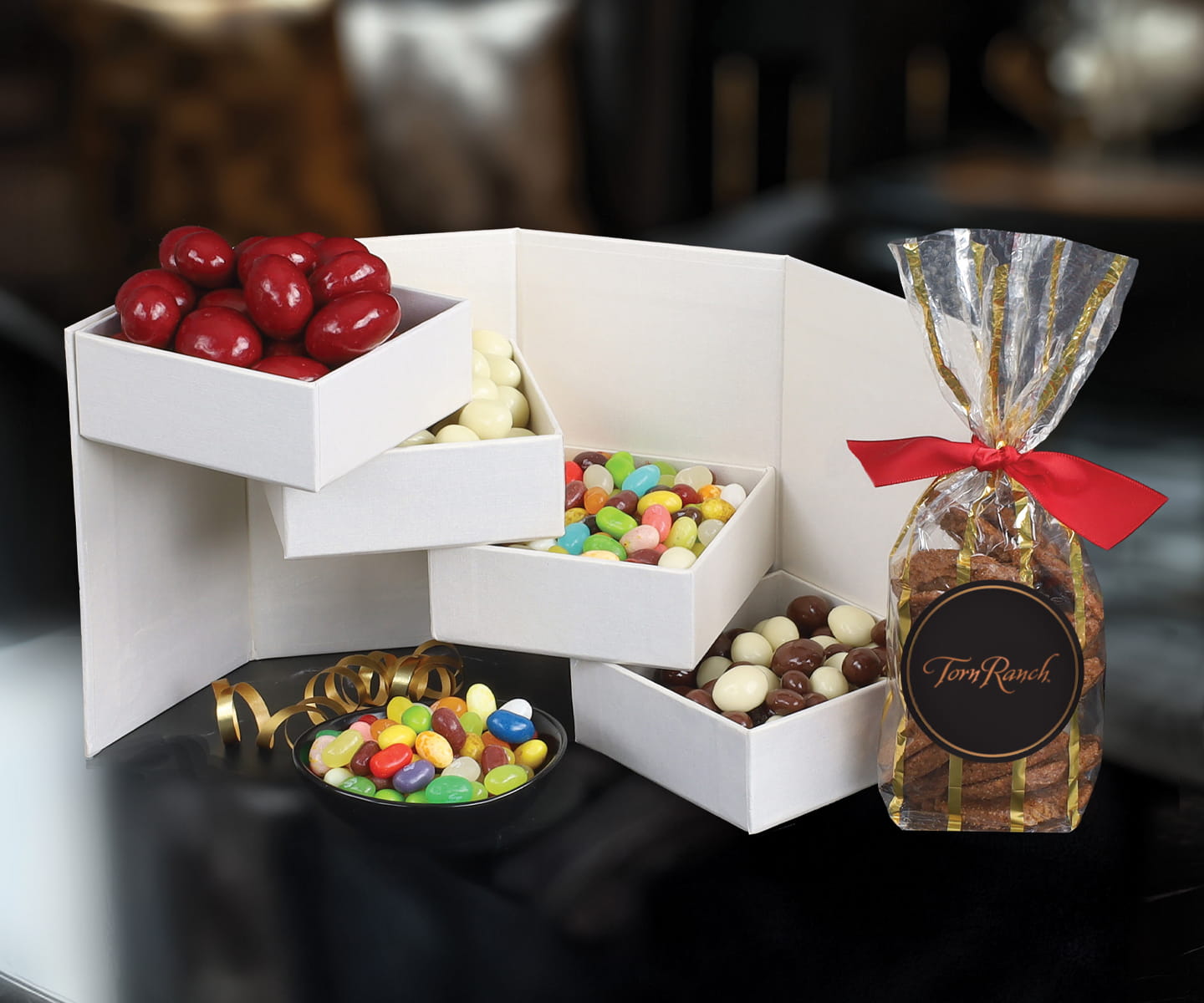 Torn Ranch small and large gourmet gifts side by side, illustrating the balance between everyday appreciation and luxury recognition.