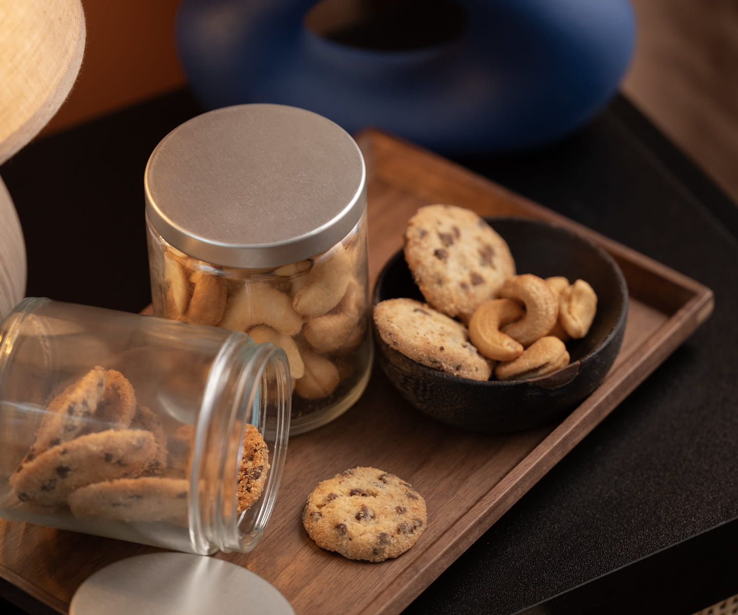 Luxury hotel welcome amenity featuring premium snacks and custom branding.