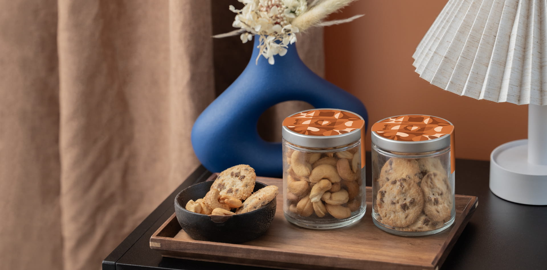 Luxury hotel welcome amenity featuring premium snacks and custom branding.