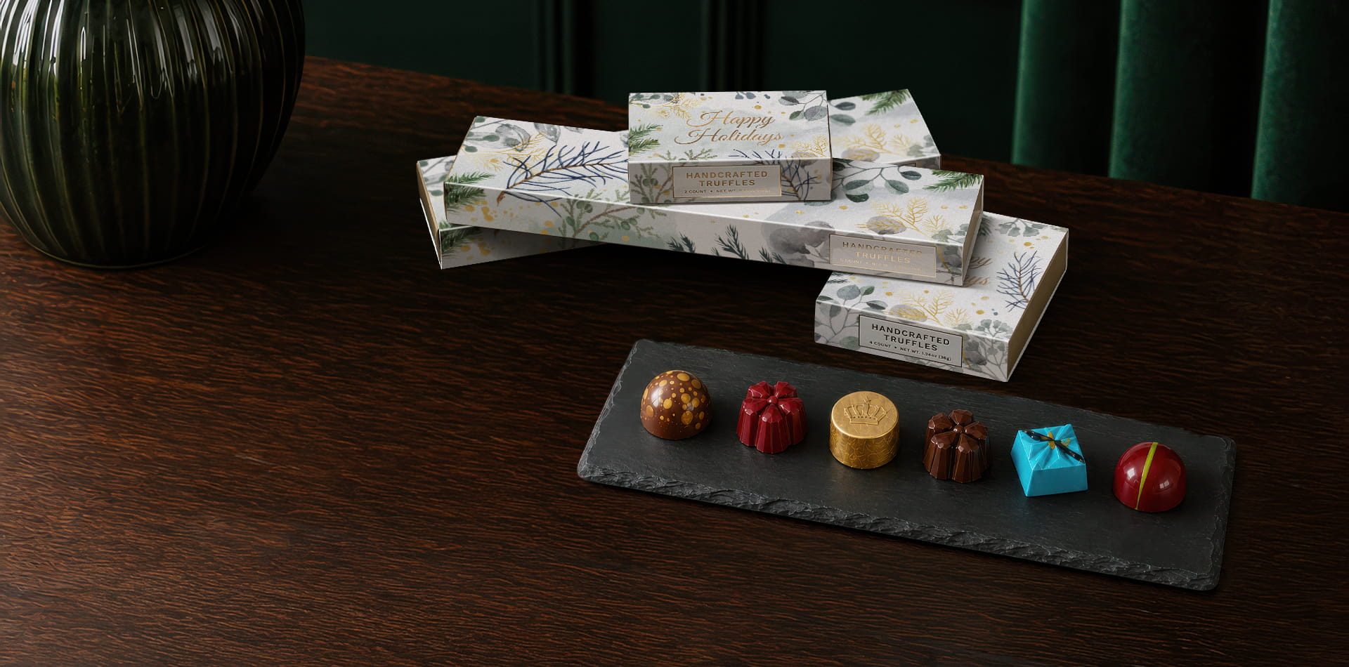 Handcrafted holiday truffles presented as an elegant seasonal welcome amenity in a luxury hotel room.
